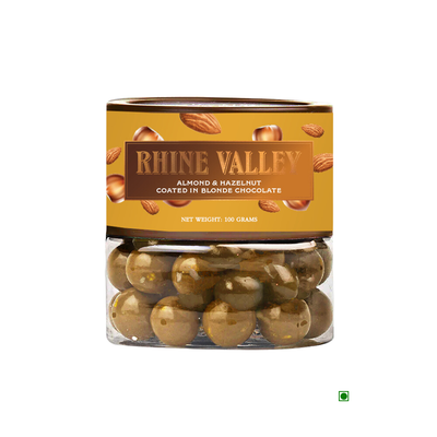 A transparent container filled with Rhine Valley Almond & Hazelnut Blonde Dragees, labeled "Rhine Valley Californian Almonds & Turkish Hazelnuts coated in caramelised white chocolate.