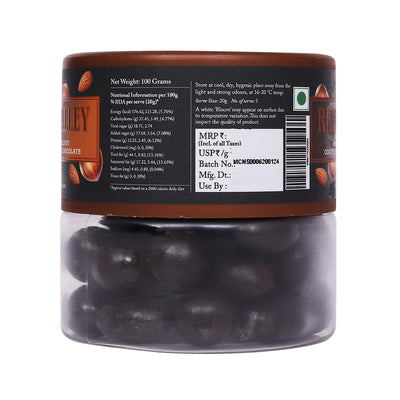 Transparent jar of Rhine Valley Almond & Hazelnut 70% Dark Dragees 100g with nutrition and product details on the label, placed against a white background.