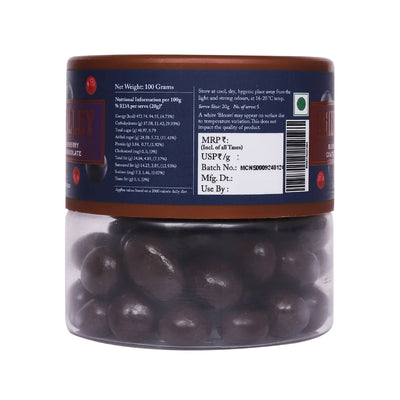 Transparent jar of Rhine Valley Blueberry & Cranberry Dark Dragees 100g with nutrition and product information labels visible.