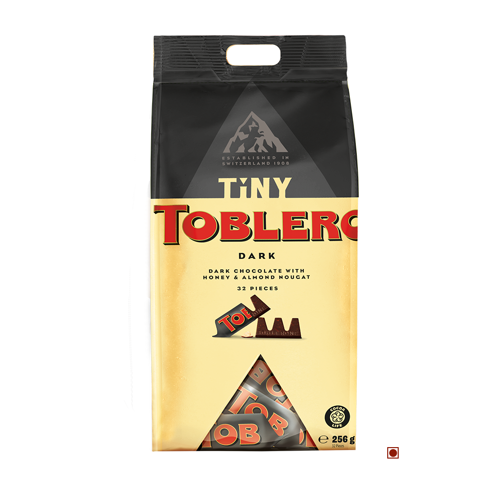 A Toblerone Tiny Dark Bag 256g originating from Switzerland. The black and gold packaging displays an enticing image of dark chocolate pieces with honey and almond nougat, highlighting the delectable Toblerone experience.