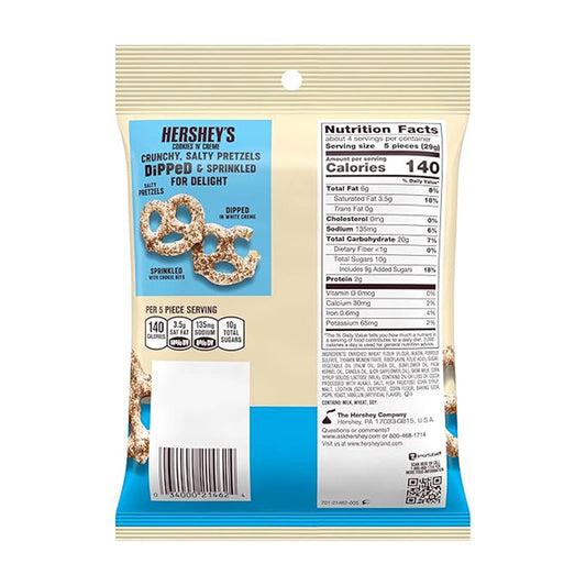 The back of a Hershey's Dipped Pretzels Cookie N Cream Bag 240g from Hershey's showcases nutrition facts alongside a tempting image of pretzels topped with chocolate cookie bits on the packaging.