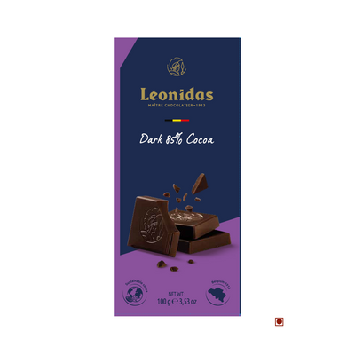 A Leonidas Dark 85% Cocoa African Origins Bar 100g packaging depicting a broken piece of chocolate and cocoa beans on a navy blue background, crafted in Belgium.