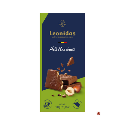 Leonidas Belgium milk chocolate bar with chopped hazelnuts packaging, featuring an illustration of broken chocolate pieces and whole hazelnuts on a dark blue background.