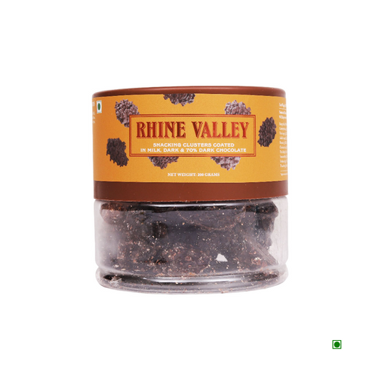 A plastic container labeled "Rhine Valley" filled with snacking clusters featuring almonds, hazelnuts, and pistachios, all coated in milk, dark, and 70% dark chocolate. Net weight is 200 grams.