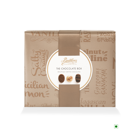 A Butlers Medium Chocolate Ballotin 320g, displayed frontally with a beige and brown design, isolated on a white background.