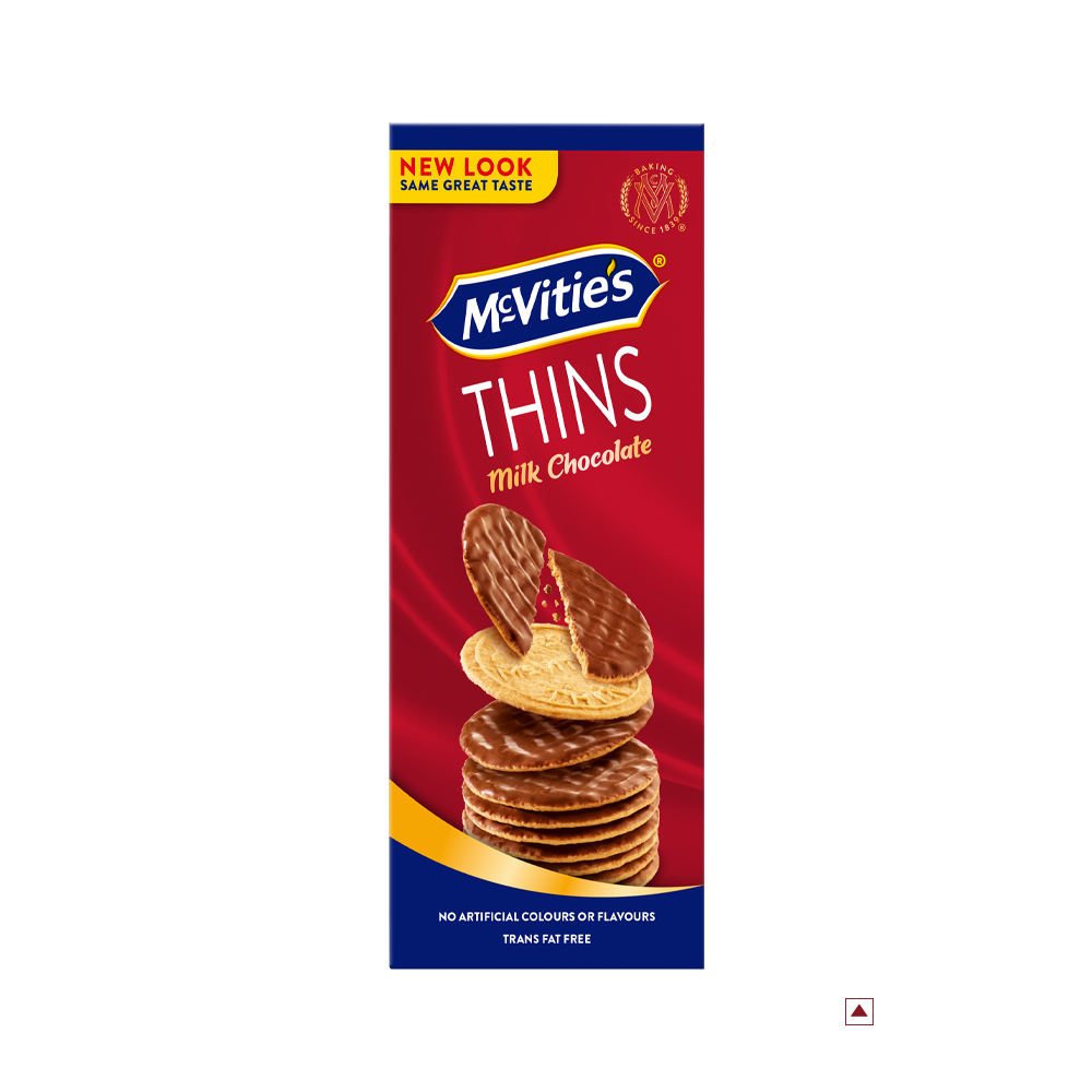 Box of McVitie’s Thins Milk Chocolate 150g biscuits showcases a red and blue design with stacked biscuits on the front. The packaging highlights "New Look" and states “Country of Origin: Egypt.”