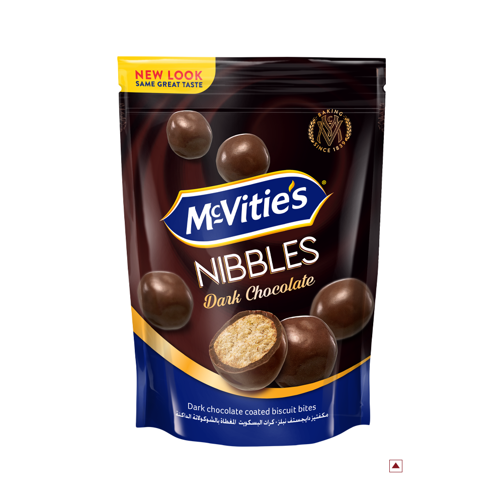 Pack of McVitie's Nibbles Dark Chocolate 110g, showcasing an enticing image of round chocolate-coated biscuit bites on the front. Indulge in this delightful treat while savoring the rich flavors that hint at its intriguing country of origin.