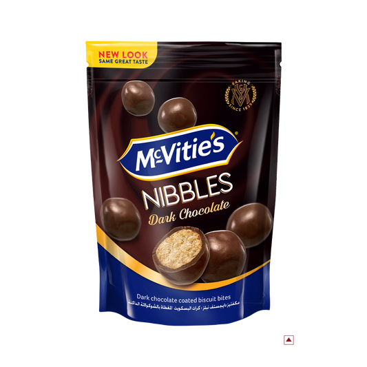 Pack of McVitie's Nibbles Dark Chocolate 110g, showcasing an enticing image of round chocolate-coated biscuit bites on the front. Indulge in this delightful treat while savoring the rich flavors that hint at its intriguing country of origin.