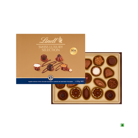 A luxurious box of Lindt Swiss Luxury Selection 193g chocolates, with the lid partially open to reveal an exquisite assortment of Lindt pralines inside. The packaging is gold and brown with a pristine white Lindt logo, making it a perfect chocolate gift.