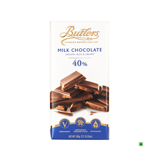 A 100g Butlers 40% Milk Chocolate Bar, crafted in Ireland. The packaging highlights its vegetarian-friendly nature, sustainably sourced cocoa, and absence of palm oil, ensuring a delightful and conscious treat.