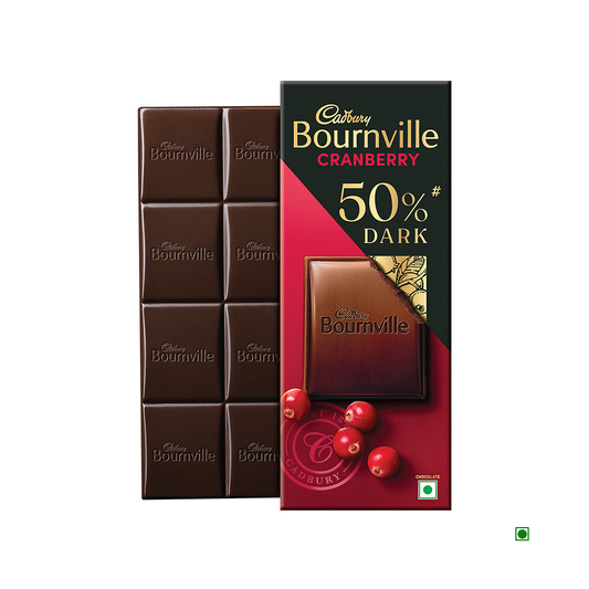 A Cadbury Bournville Cranberry Dark Chocolate Bar 80g, a decadent treat infused with 50% rich cocoa, is partially unwrapped to reveal its tempting pieces and succulent cranberries.