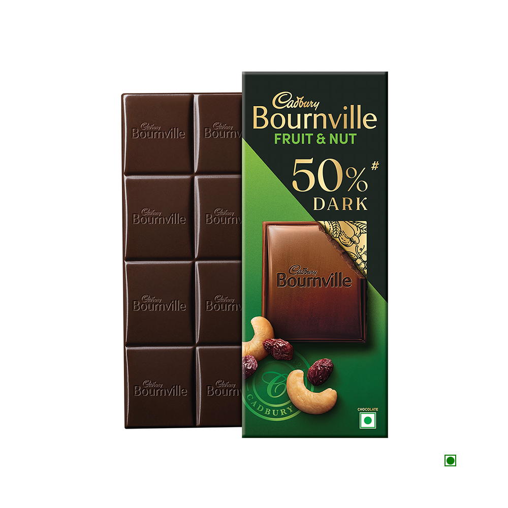 Cadbury's Bournville Fruit & Nut Dark Chocolate Bar, weighing 80g, proudly contains 50% cocoa. The packaging artfully displays partially opened chocolate squares paired with cashew nuts and cherries, tempting you to enjoy its rich combination of flavors.