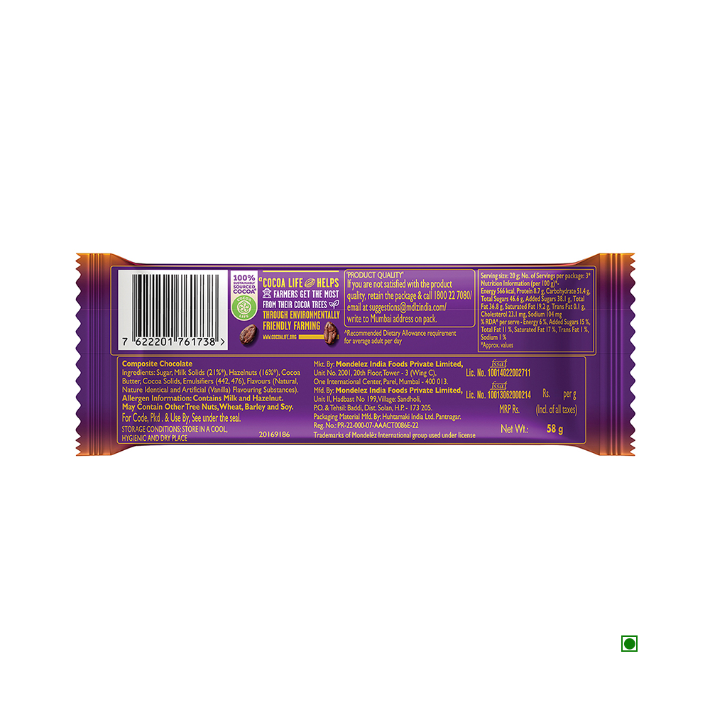 The back view of a Cadbury Dairy Milk Silk Hazelnut Chocolate Bar 58g wrapper reveals the barcode, ingredients, and product information against a purple backdrop, hinting at its rich milk chocolate infused with hazelnuts.