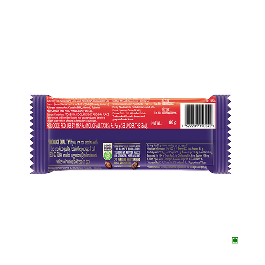 The back view of a Cadbury Dairy Milk Fruit & Nut Chocolate Bar 80g wrapper features vibrant red and purple colors, comprehensive nutritional details, and a barcode. Crafted with sustainably sourced cocoa, this delightful treat from Cadbury ensures quality in every bite.