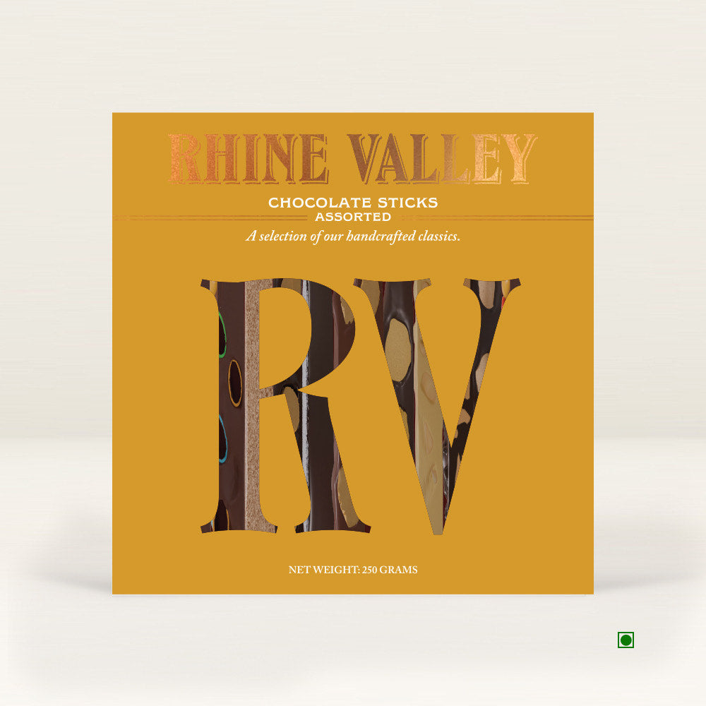 Square box of Rhine Valley Assorted Sticks, prominently featuring large "RV" letters on a golden background. Net weight: 250 grams. Made in India.