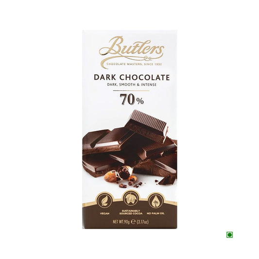 The Butlers 70% Dark Chocolate Bar 90g, crafted in Ireland, is packaged with designs featuring images of chocolate pieces and ingredient information. It is labeled as vegan and free from palm oil, offering a rich taste experience with sustainably sourced cocoa solids.