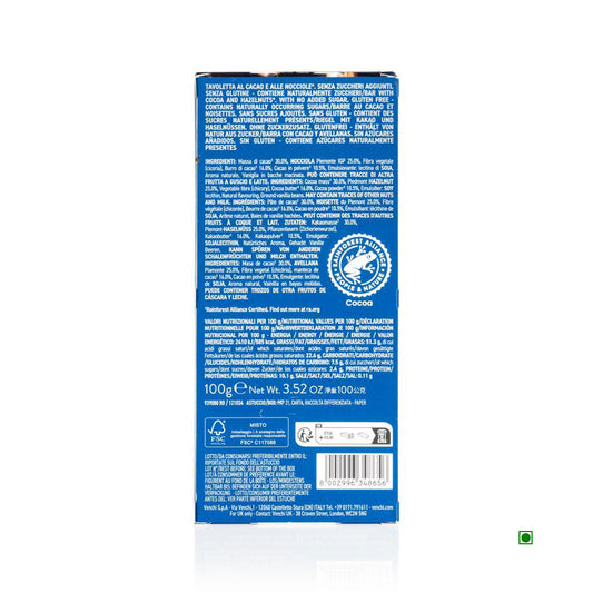 The Venchi Extra Dark With Hazelnut No Added Sugar Bar 100g package features its ingredient list, Piedmont Hazelnut infusion, high fiber nutritional info, and recycling symbol, all on a captivating blue background.