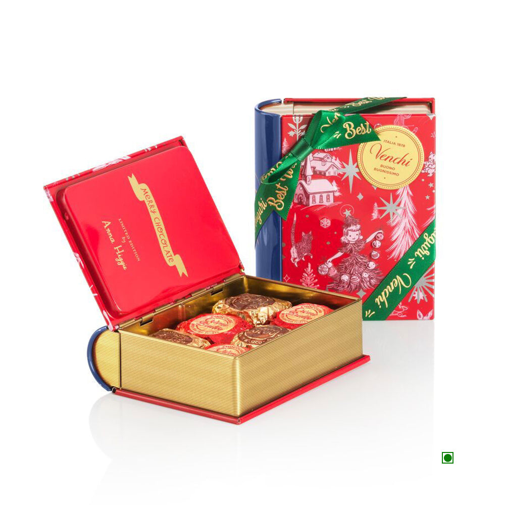 The Venchi Christmas Anna Higgie Mini Book 118g by Venchi is an iconic chocolate box designed like a book, decorated with Christmas motifs and a green ribbon, revealing gold and red foil-wrapped chocolates with unexpected fillings like Crème Brulée that surprise and delight.