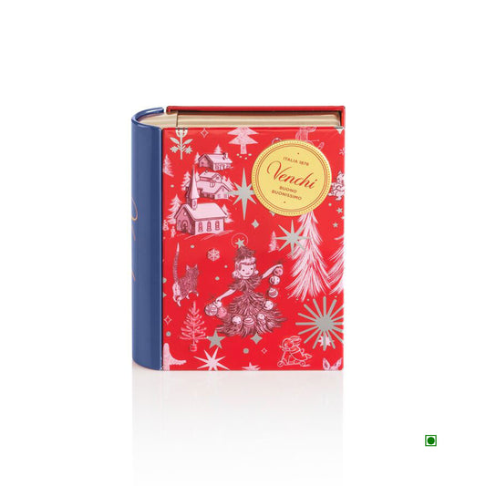 The Venchi Christmas Anna Higgie Mini Book 118g is a red and blue, book-shaped box with holiday illustrations and a gold "Venchi" label. It offers adventurous surprises, including the Crème Brulée version, capturing iconic chocolate indulgence.