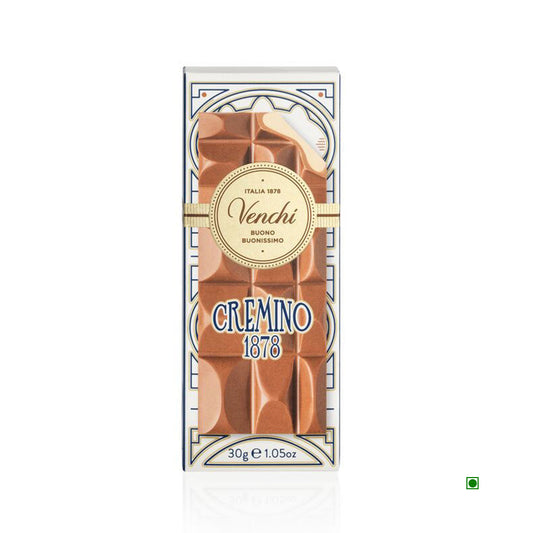 The Venchi Mini Cremino Chocolate Bar 30g, elegantly wrapped in white and gold with a decorative design, highlights the rich tradition of Piedmontese chocolate.