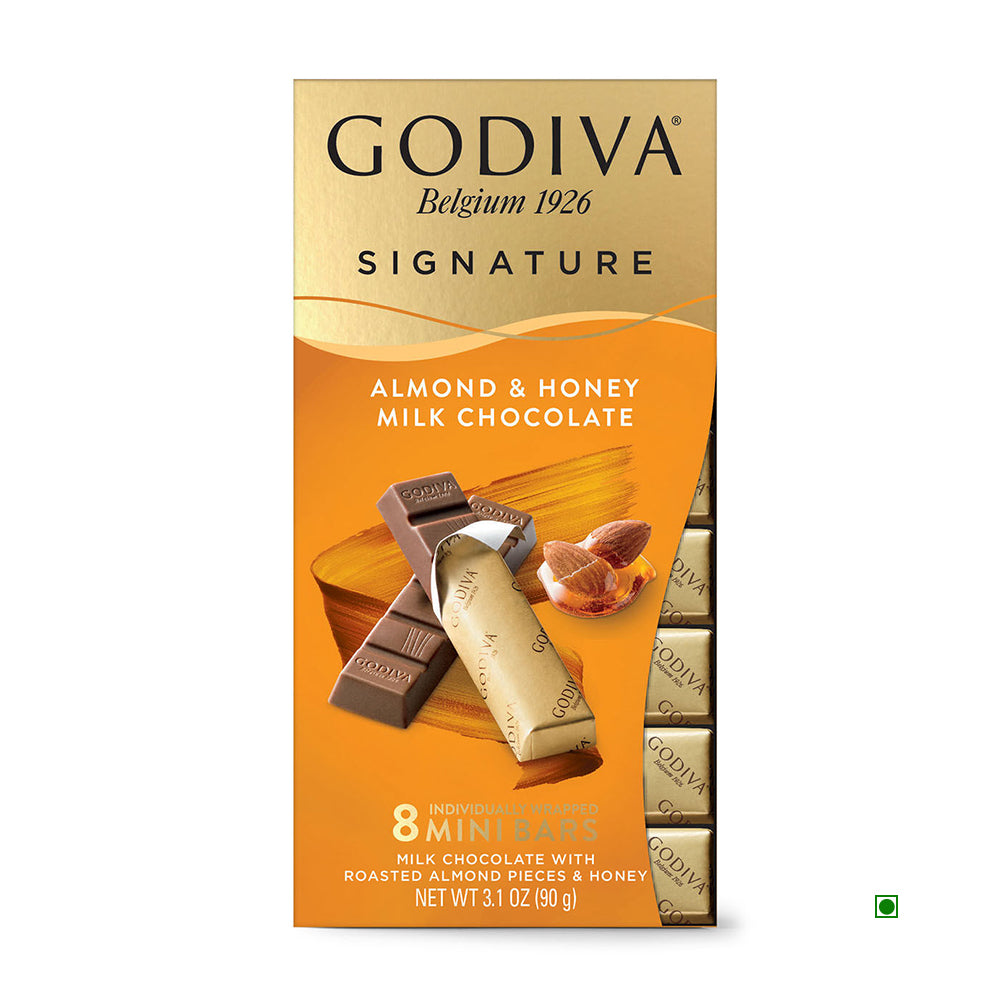 The Godiva Signature Honey Almond Milk Chocolate Sticks offer exquisite milk chocolate infused with honey and premium almonds. This elegant open box contains 8 mini bars, weighing a total of 90g (3.1 oz), delivering a sophisticated and rich flavor experience.