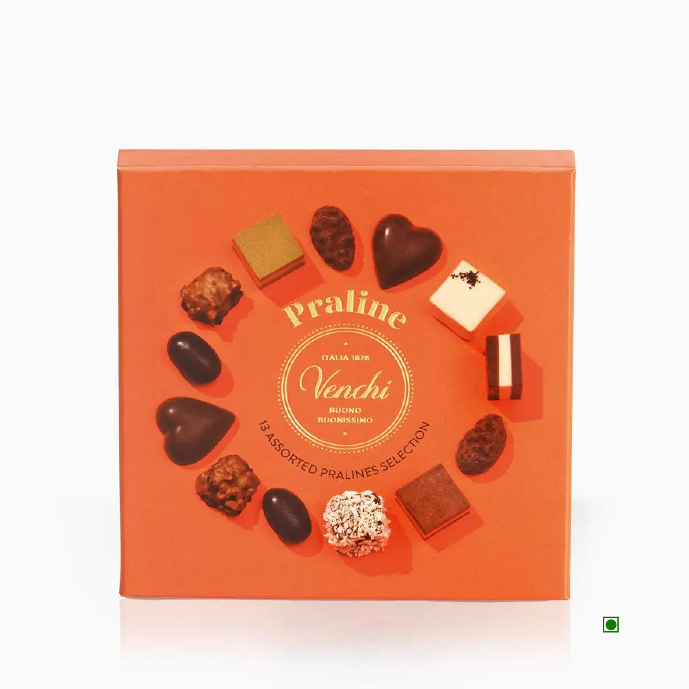 The Venchi Praline Gift Box 105g, crafted in Italy, includes various shaped chocolates arranged in a circle on an orange background.