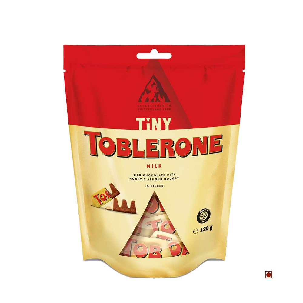 Toblerone Tiny Milk Bag 120G by Cococart India contains individually wrapped Swiss milk chocolate pieces with honey almond nougat.