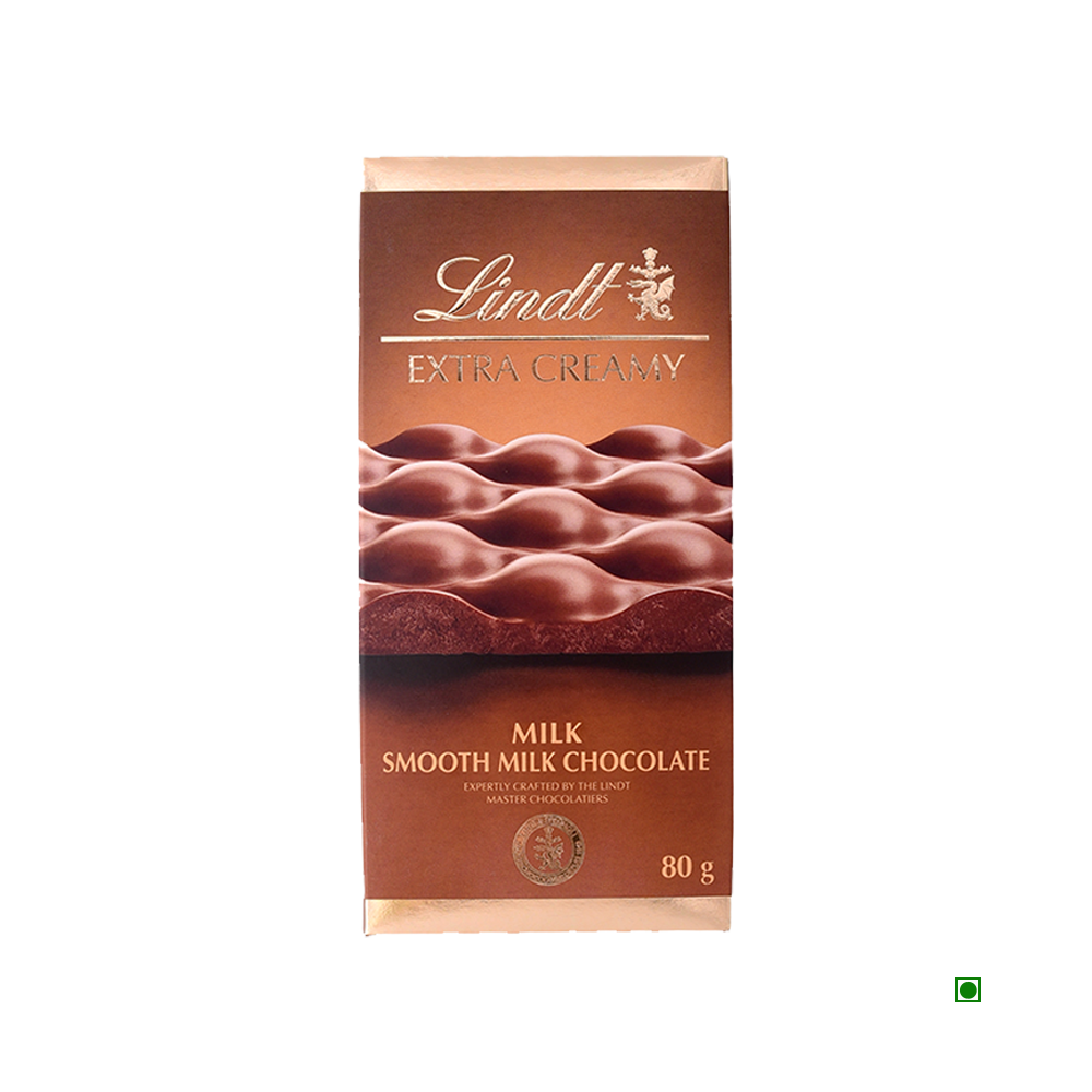 Lindt Extra Creamy Milk Tablet 80g, by Lindt, features a wavy chocolate design on its packaging and is made in France.