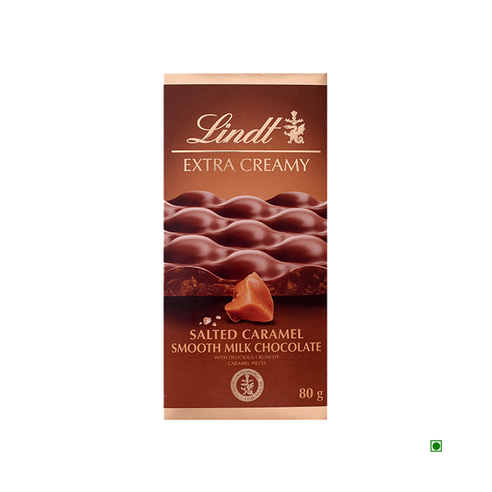 Lindt Extra Creamy Salted Caramel Tablet 80g by Lindt, featuring caramel pieces on the wrapper. Made in France and proudly showcasing its French origin.