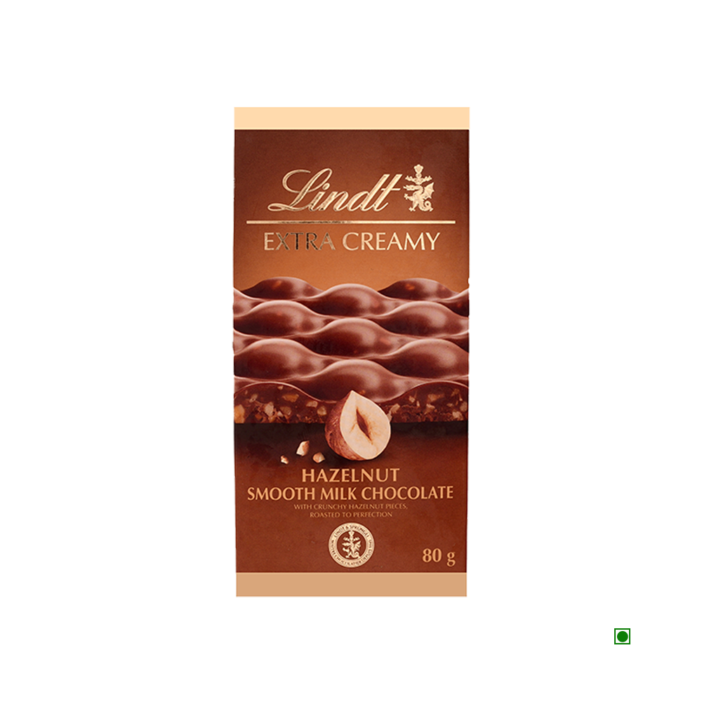 Lindt Extra Creamy Hazelnut & Sea Salt Tablet 80g by Lindt features chocolate pieces and hazelnuts on its packaging and highlights France as the country of origin.