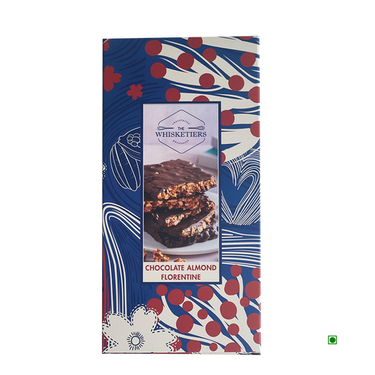 A rectangular box of Whisketiers Almond Dark Chocolate 100g with a blue, red, and white floral design, featuring rich dark chocolate and crunchy roasted almonds.