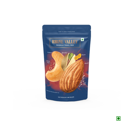 A blue pouch labeled "Rhine Valley Masala Trail Mix 100g" featuring illustrations of almonds, cashews, and other ingredients proudly highlights its Country of Origin - India.