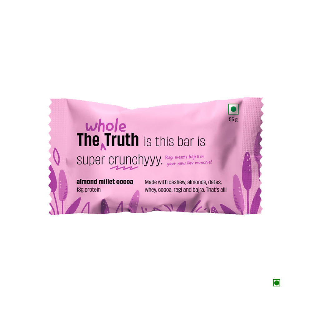 A colorful pink and purple package features "The Whole Truth Almond Millet Cocoa Protein Bar 55g," highlighting its rich blend of ingredients like almonds and chocolate for extra crunch in the almond millet cocoa flavor.