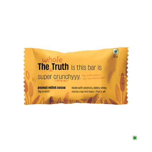 The packaging of "The Whole Truth Peanut Millet Cocoa Protein Bar 55g" highlights its crunchy texture and nourishing ingredients, including protein-rich peanuts, millet, whey, rich date chocolate, and dates.