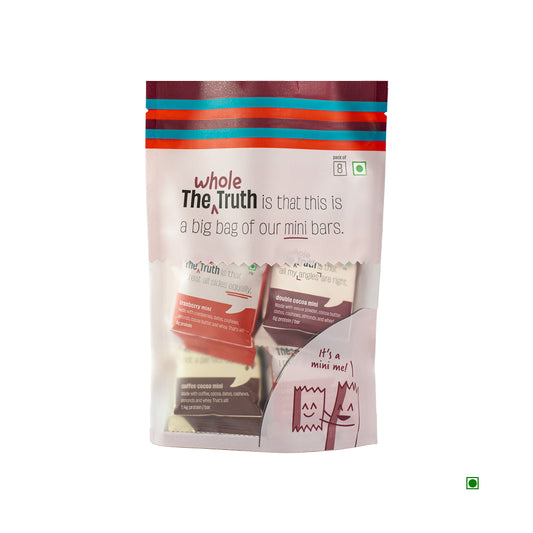 A vibrant pack of "The Whole Truth" Mini Protein Bars (216g) features colorful packaging and clear nutritional information, prominently emphasizing its Indian origin.