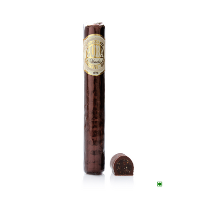 A Venchi Aromatic Chocolate Cigar 100g with a piece of hazelnut paste next to it.