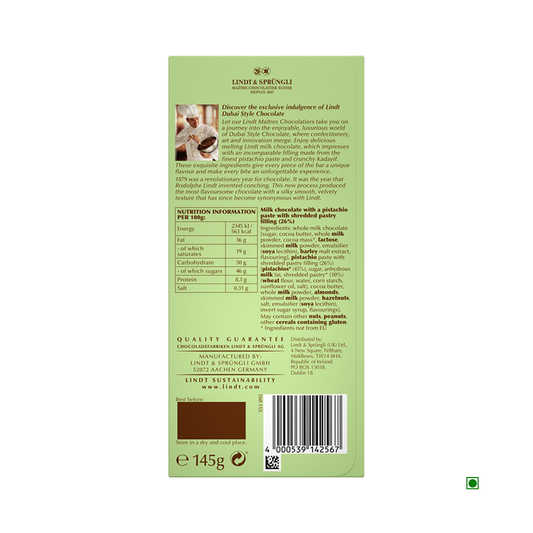 Back of a Lindt Dubai Chocolate 145g bar showing product description, ingredients such as pistachio filling and nut brittle, nutrition facts, Lindt branding, manufacturer info, barcode, and 145g net weight.