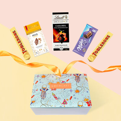 A Gift Hampers gift box with The Celestial Blue Celebration : Pyramid chocolates and a ribbon.