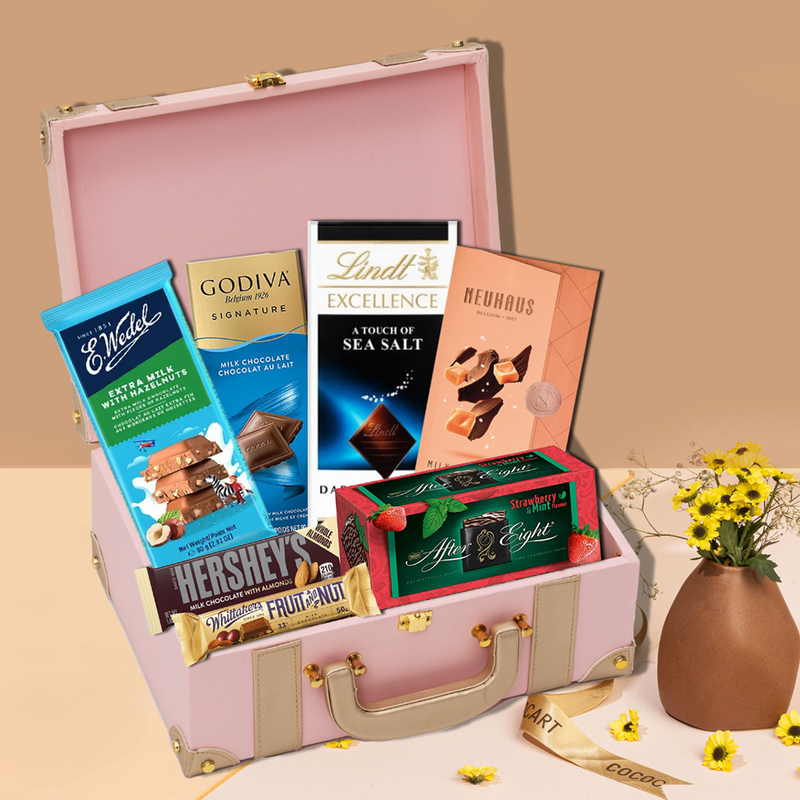 A Blush Trunk filled with chocolates and flowers from Gift Hampers.