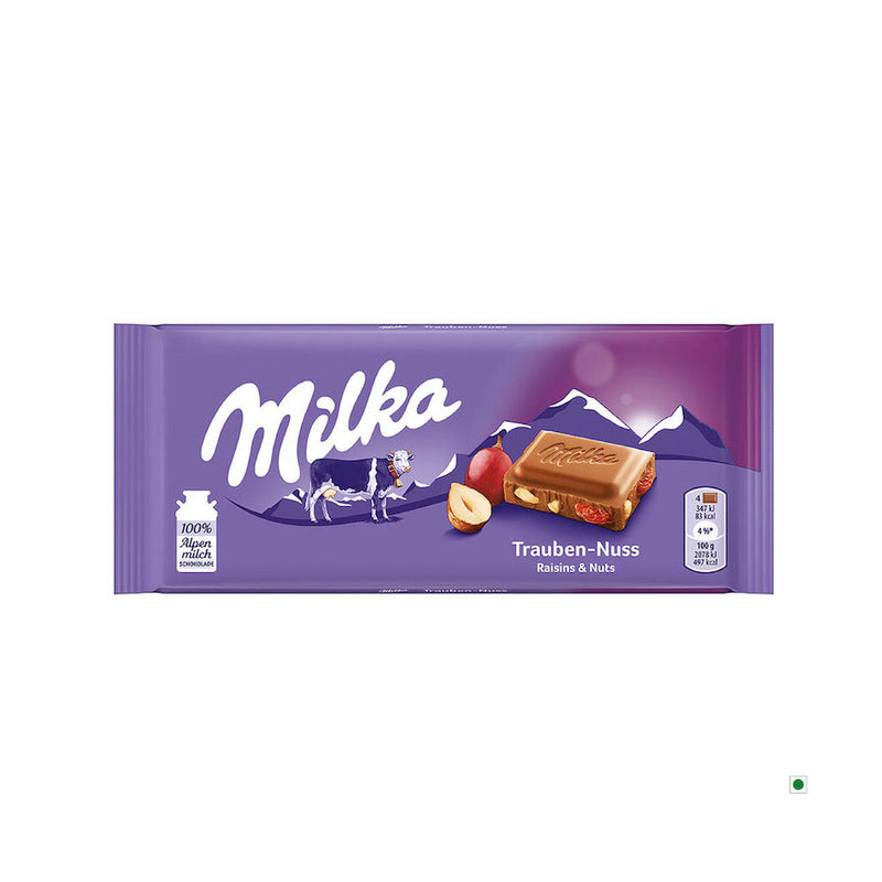 A Milka Raisin and Nut Bar 100g with an image of a cow.