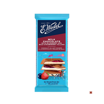 A Wedel Milk Chocolate With Blueberry & Wild Strawberry Filling Bar 100g with fruit and berries on it.