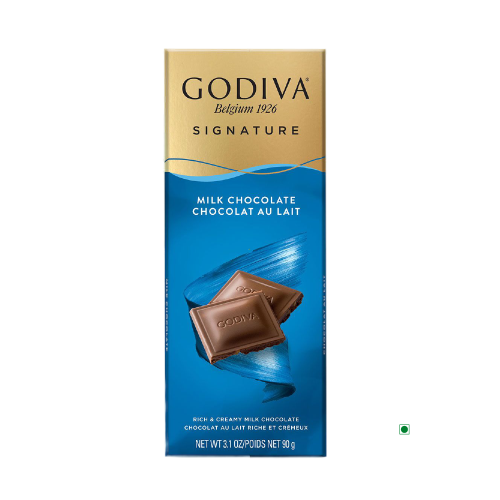 The packaging of the Godiva Milk Chocolate Bar 90g beautifully captures the essence of Belgium, featuring two indulgent chocolate squares set against a calming blue backdrop.