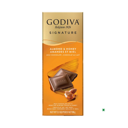 A Godiva Milk Honey Almond Bar 90g, with its packaging showcasing roasted almonds and sweet honey, embodies the rich tradition of a classic Belgian chocolate bar.