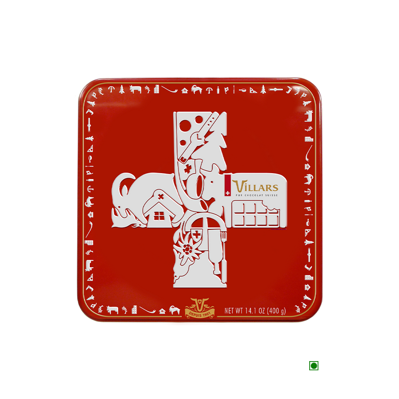 A Villars Milk Napolitains Tin Box 400g with an image of a cross on it.