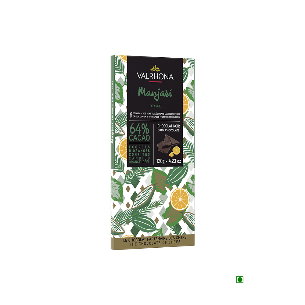 A Valrhona Manjari Orange Peel 64% Bar 120g with oranges and lemons on it.