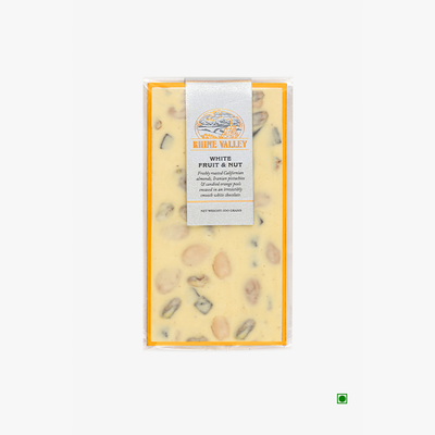 A Rhine Valley White Fruit & Nut 100g bar of cheese with nuts and seeds on it.