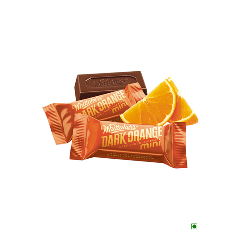 A Pick & Mix : Whittakers Loose Dark Orange Squares 100/200gm bar with orange slices next to it, infused with the refreshing taste of orange oil.
