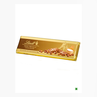 A bar of Lindt Gold Tab Milk with Hazelnuts 300g chocolate on a white background.