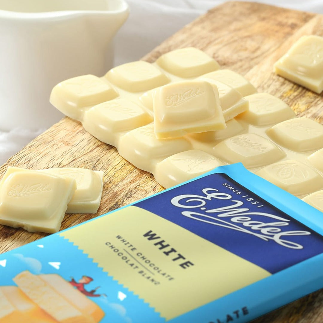 Wedel's Wedel White Chocolate Bar 80g on a cutting board.