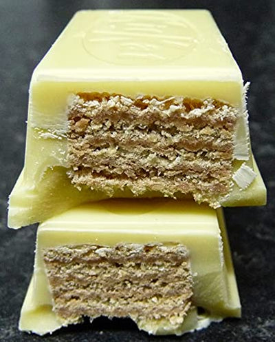 Stack of Kit Kat Chunky White 40gm bars with a cross-section showing crunchy wafers and multiple layers inside.